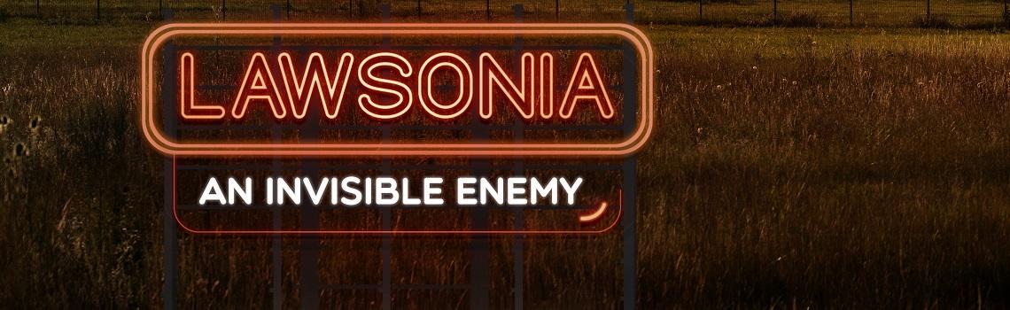 Image of a sign "Lawsonia an invisible enemy" in a field